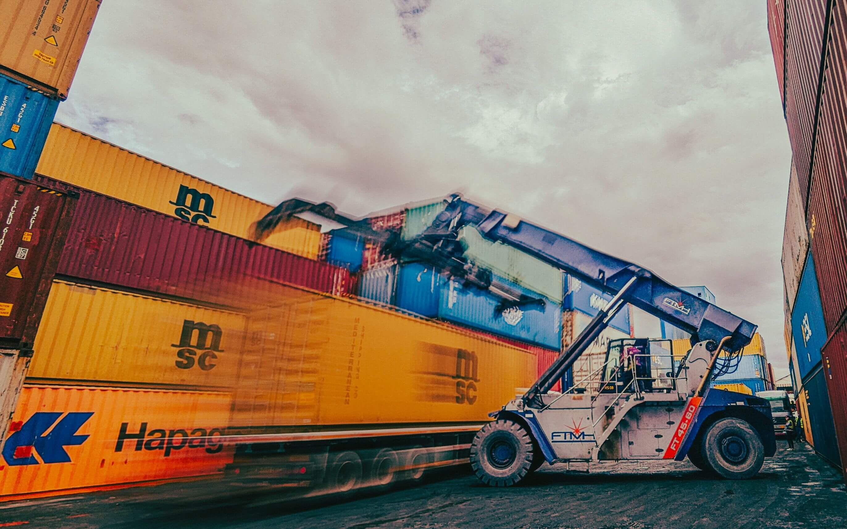 Cargo ship loaded with export containers at port